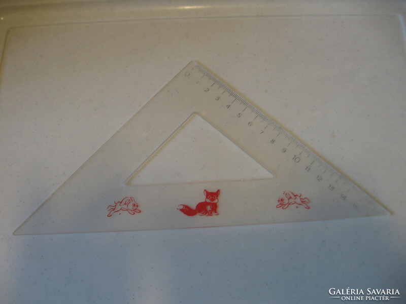 Retro plastic triangle ruler with fox and bunny.