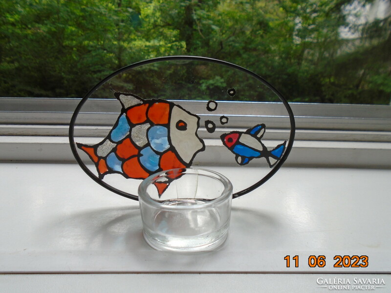 Colored enamel fish painted on leaded glass with a candle holder