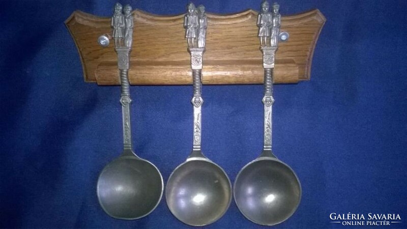 Wall-mounted, pewter decorative spoon set