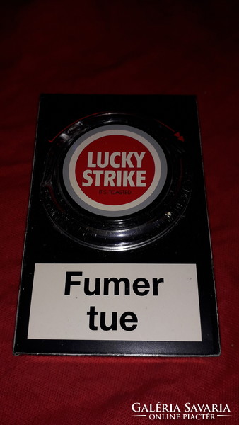Old metal plate lucky strike cigarette box that can be opened with a rotary button according to the pictures