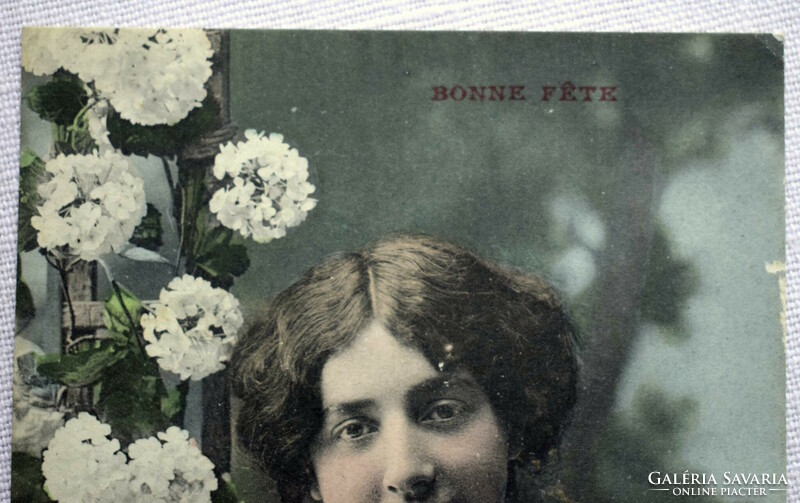 Antique greeting colored photo postcard with lady flowers