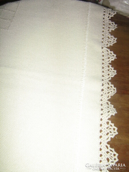 A woven tablecloth embroidered with beautiful crocheted edges