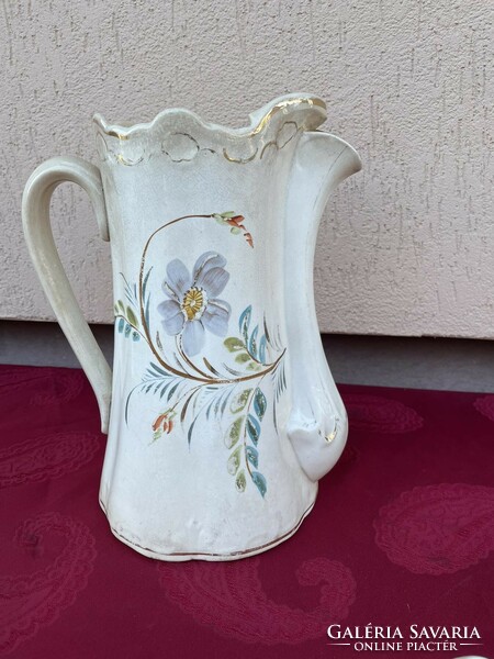 Antique earthenware large jug with floral design