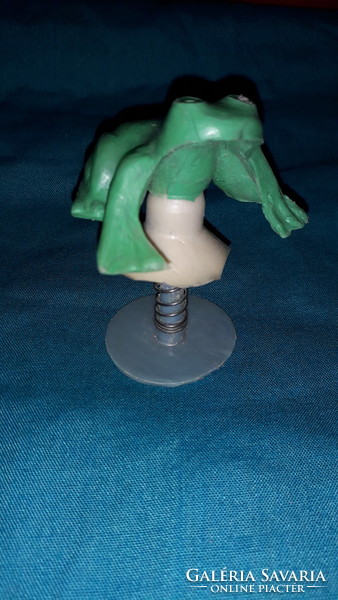 Old 1960s first-generation, classic plastic frog with a jumping adhesive disc from the shop, as shown in the pictures