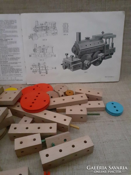 Old retro wooden matador building toy with ingredients booklet