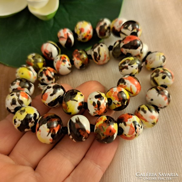 Porcelain handmade string of beads.