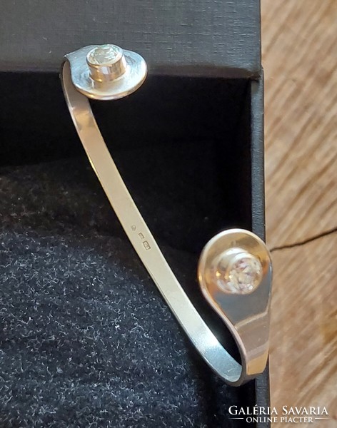 Open silver bracelet with zirconia stones