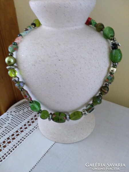 Necklace decorated with green and various colored Murano glass beads