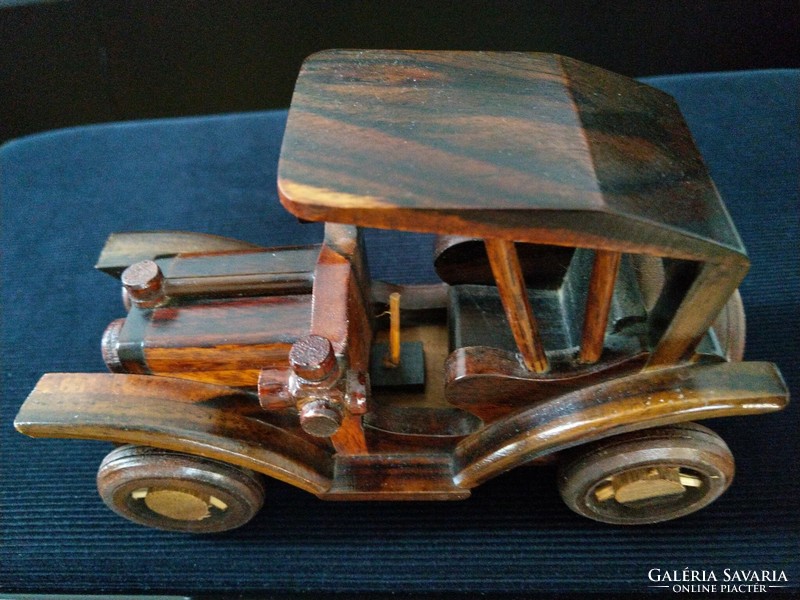 Carved, stained wooden car