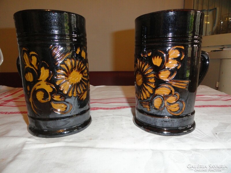 Richly decorated glazed earthenware jugs