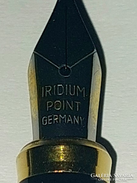 Old iridium point germany fountain pen in burgundy color.