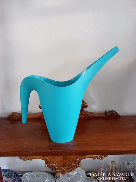 Turquoise blue sprinkler, watering can
