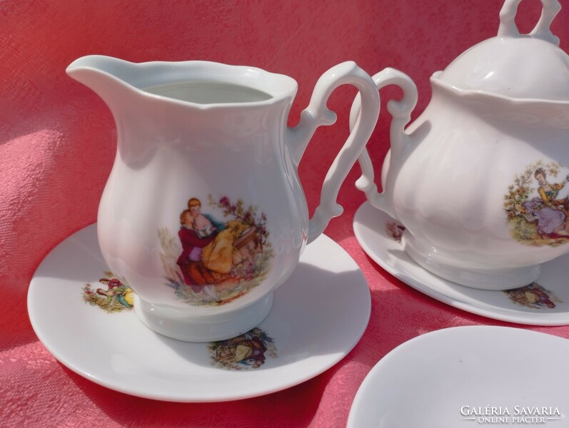 A beautiful porcelain coffee set with a baroque scene