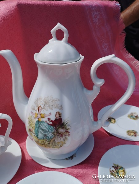 A beautiful porcelain coffee set with a baroque scene