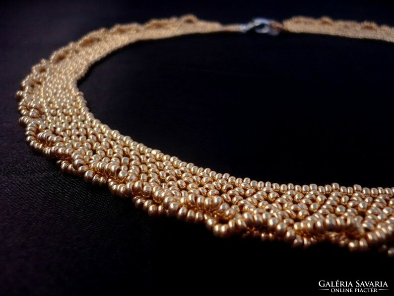 Gold colored pearl necklace