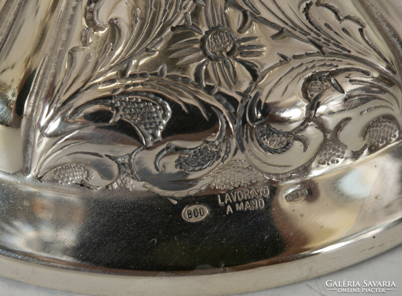 Large silver vase with cream-shaped ears, richly decorated