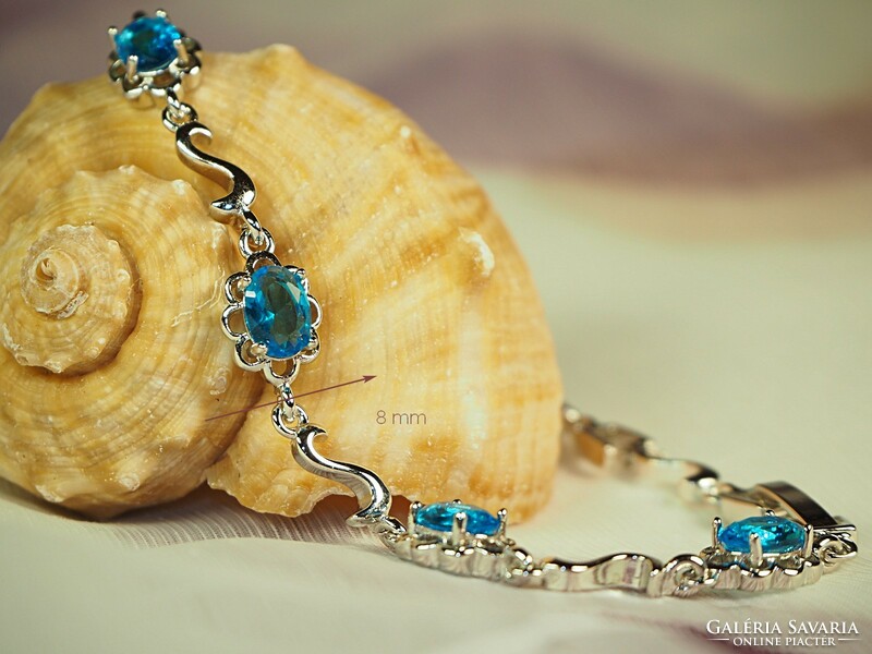 Silver colored (goldfilled) bracelet with flower pattern, turquoise blue stones