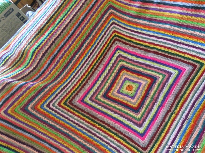Cheerful colorful hand crocheted bedspread.