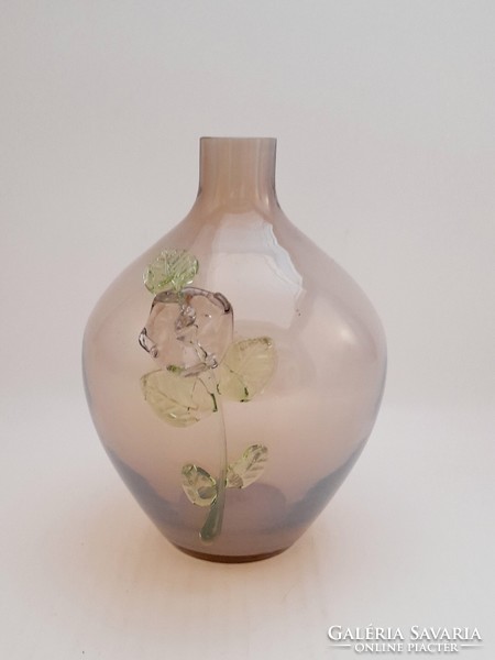 Glass vase with plastic flower