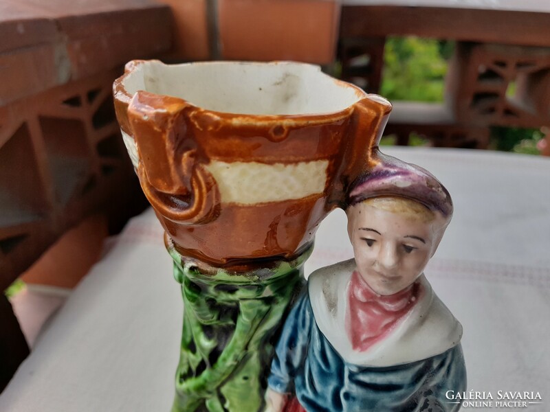 Art Nouveau majolica vase with a small figure
