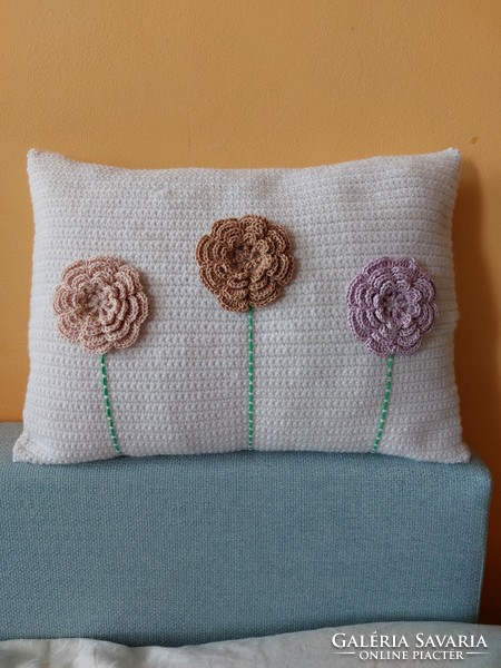 Unique white hand crocheted decorative pillow with 3D flowers.