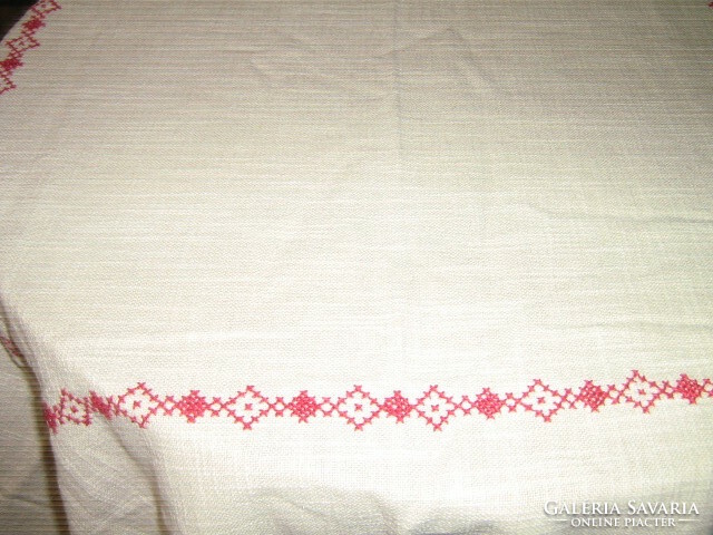 Beautiful antique hand-embroidered elegant woven tablecloth with crocheted lace on the edge