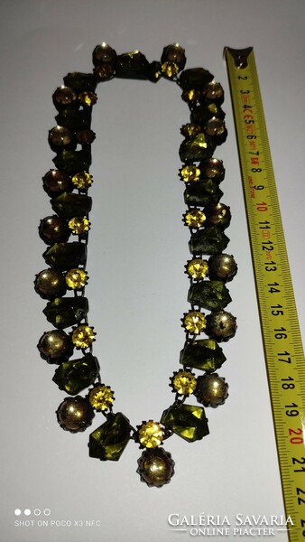 Vintage opulent design jewelry, shiny metal necklace with shining stones, the wedge of the summer is believed to have been plotted