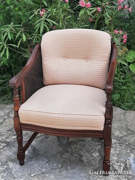 A round caned armchair in good condition
