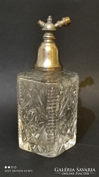 Antique perfume bottle with metal perfume highlighter