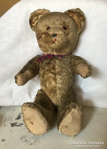 A very old teddy bear