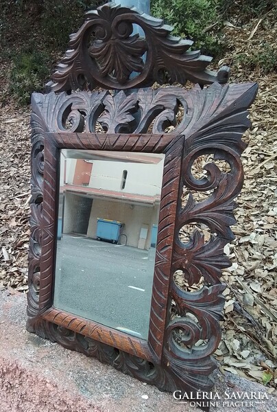 French Florentine polished mirror in an antique wooden frame