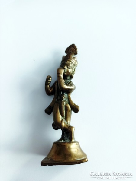 A copper figure representing a Mayan deity
