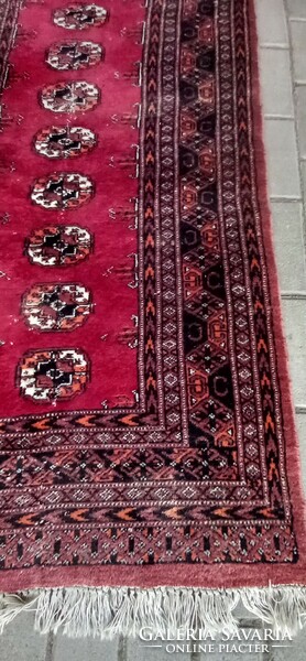 Hand-knotted bochara running rug is negotiable