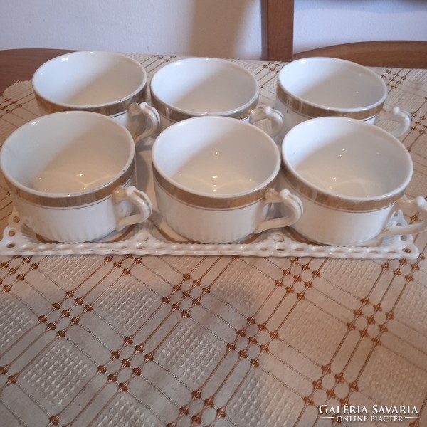 Divided porcelain teacups with gilded decor