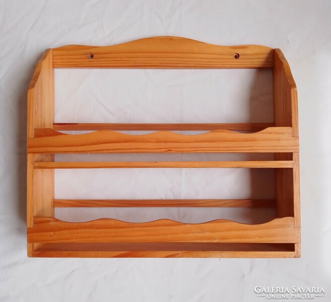 Old kitchen wooden spice shelf with folk character