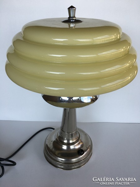 Art deco lamp with a butter colored looped cover