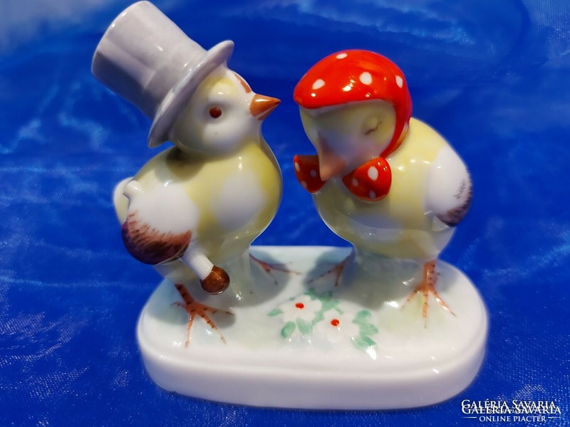 A pair of charming old porcelain chickens