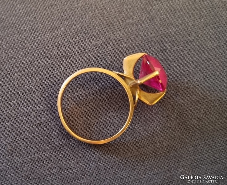 Gold ring with red stones
