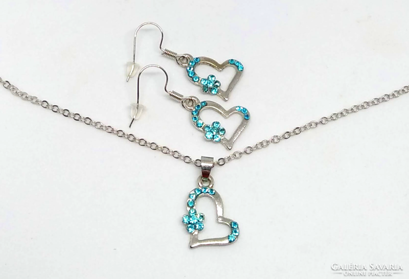 Silver necklace and earrings set with heart pendant decorated with blue crystals