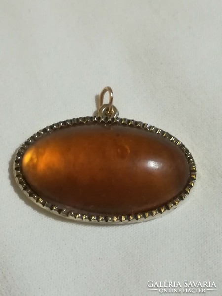 Old amber pendant.
