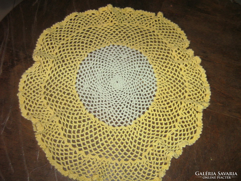 Beautiful antique handmade crocheted round tablecloth with wavy edges