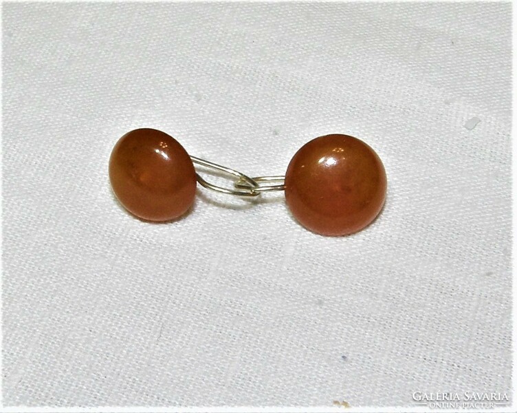A pair of amber stone earrings in a gold-plated silver socket