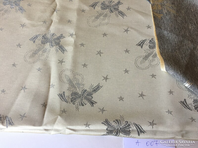 Ekrü-colored piece of fabric with a Christmas pattern (a007)
