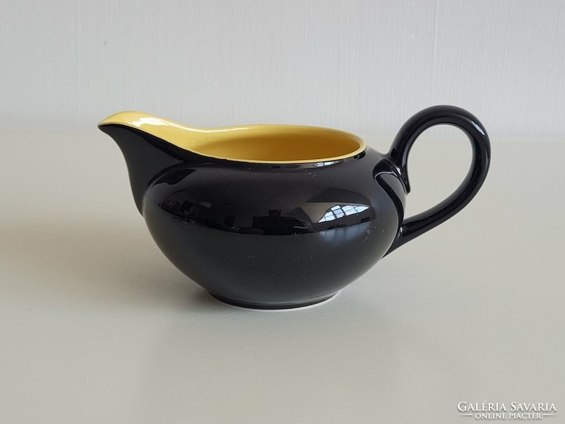 Glazed ceramic pouring black yellow small jug