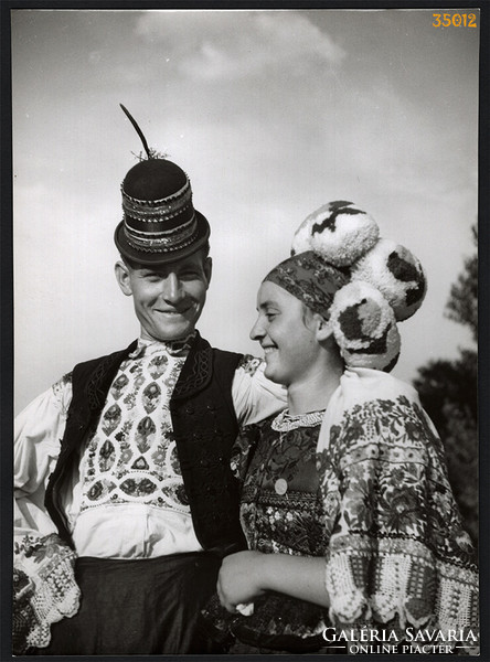Larger size, photo art work by István Szendrő. A young couple in national costume, field stones, pepper-