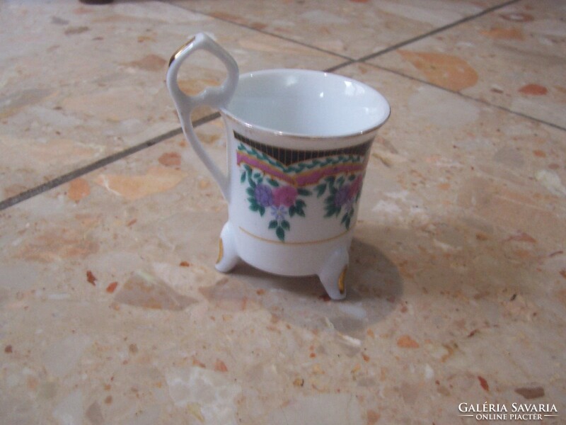 A wonderful little cup standing on legs