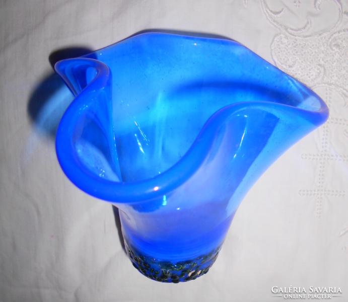 A special flower figure made of glass in a handcrafted small frame glass studio