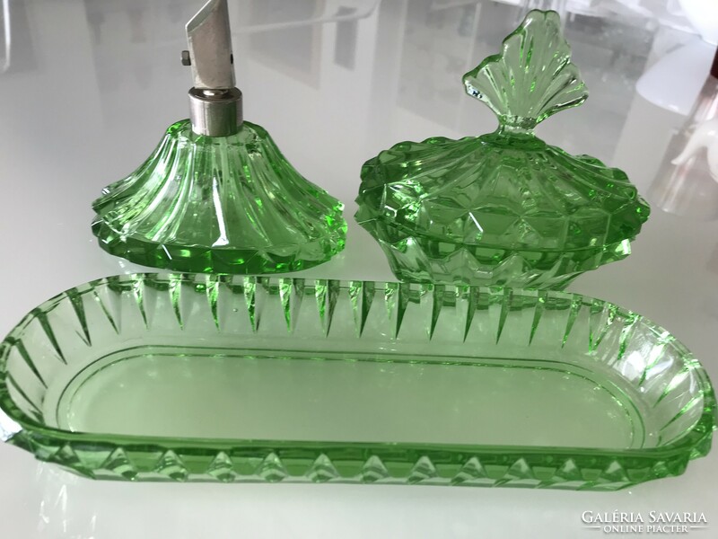 Antique toilet set made of bright green glass
