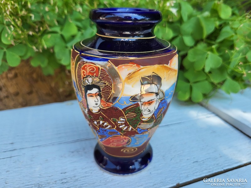 Japanese porcelain vase with hand relief painting