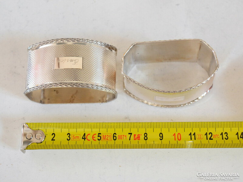 Pair of silver napkin rings, oval shape. Art deco style monogrammed nf with gold diss